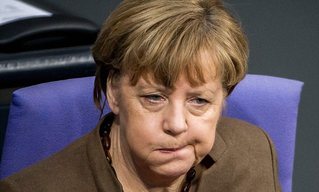 German Chancellor Angela Merkel reacts a